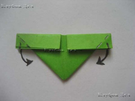 Fold the corners, bending them over a large triangle